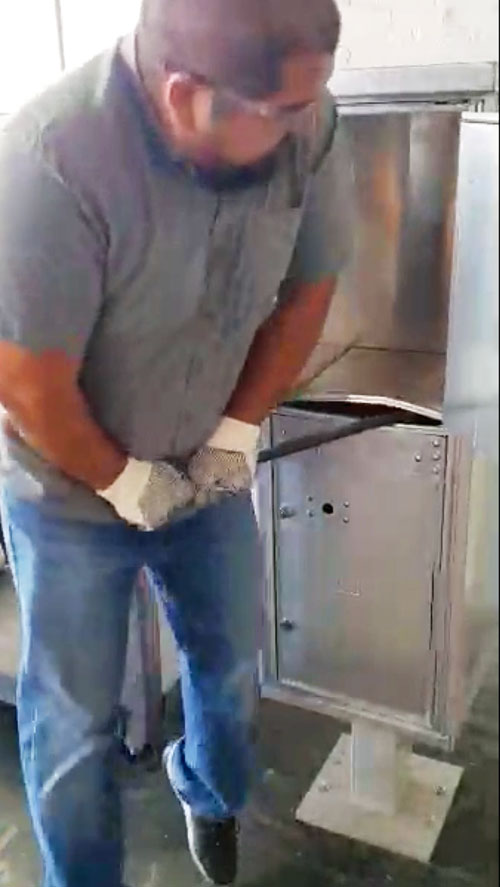 Man Breaking into a Mailbox
